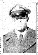 Black and white image of a man wearing military uniform sitting for a portrait