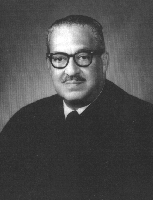 Black and White Portrait of a Man wearing judge court attire