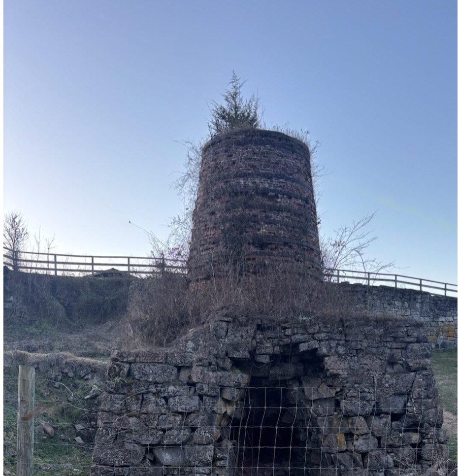 Chimney outside used as a burial mound at a cemetery 