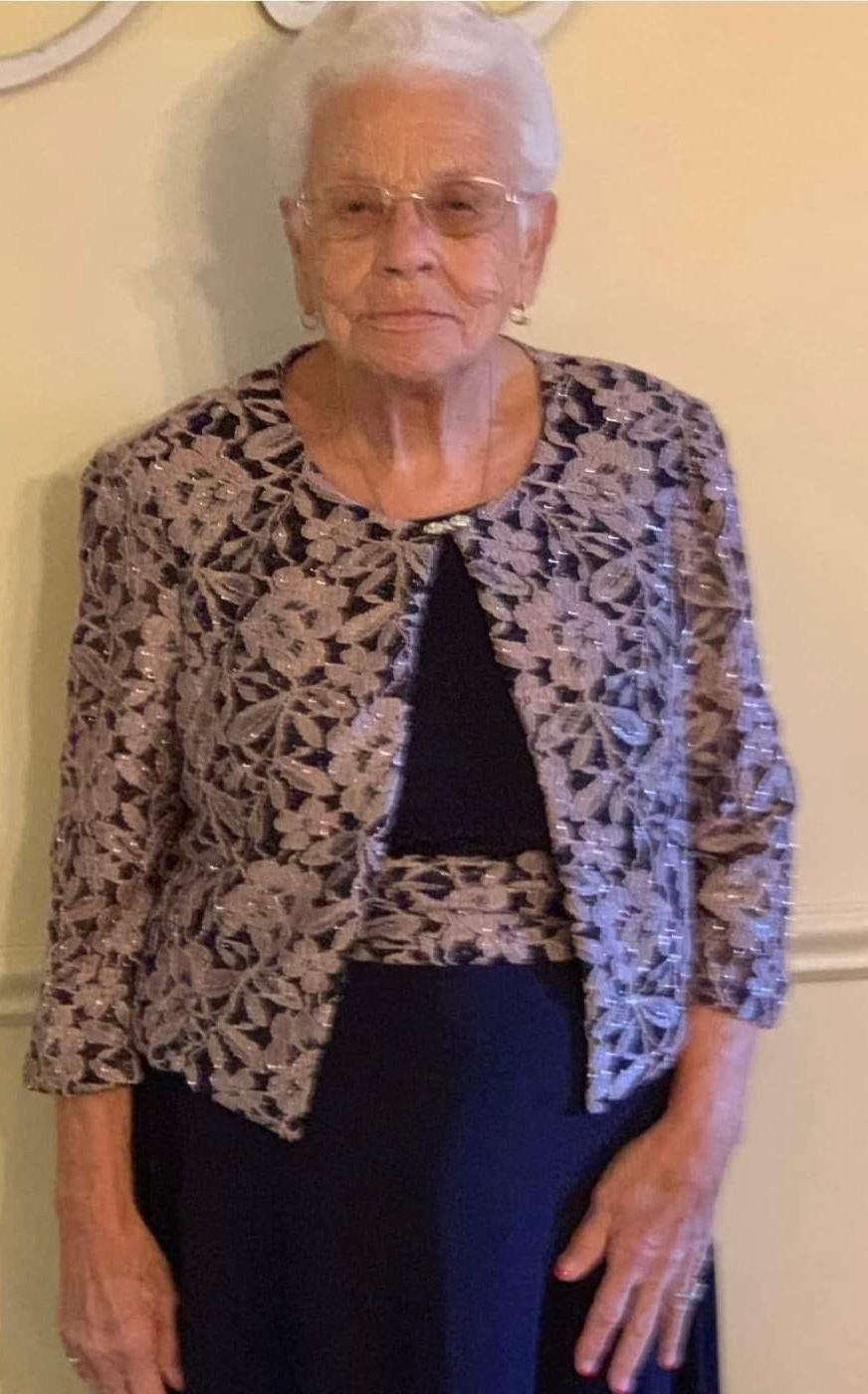 image of an elder black woman standing and posing for a photo