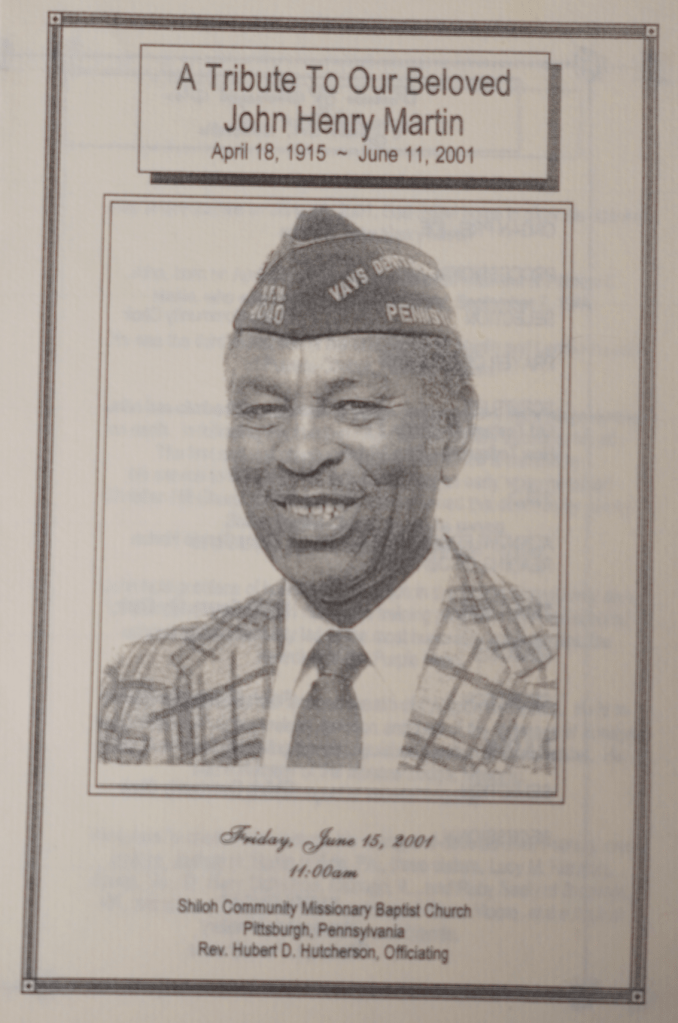 Image of funeral pamphlet with image of a black man centered wearing a military hat