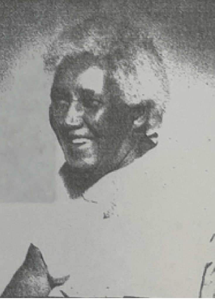 Older woman wearing all white with grey hair posing for a portrait. She has a large smile and is gazing to the left side of the frame. 