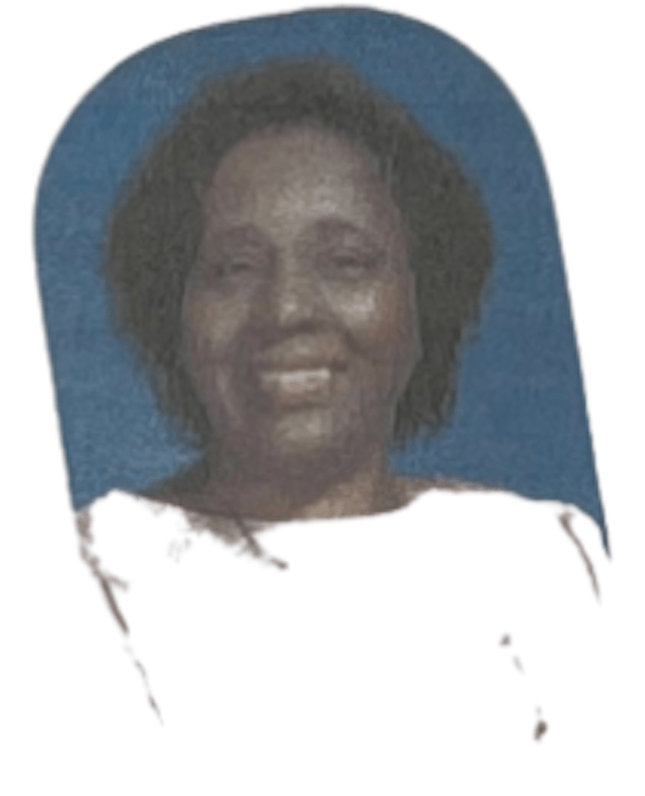 Ovular image of a woman with short hair wearing a white shirt smiling with squinted eyes