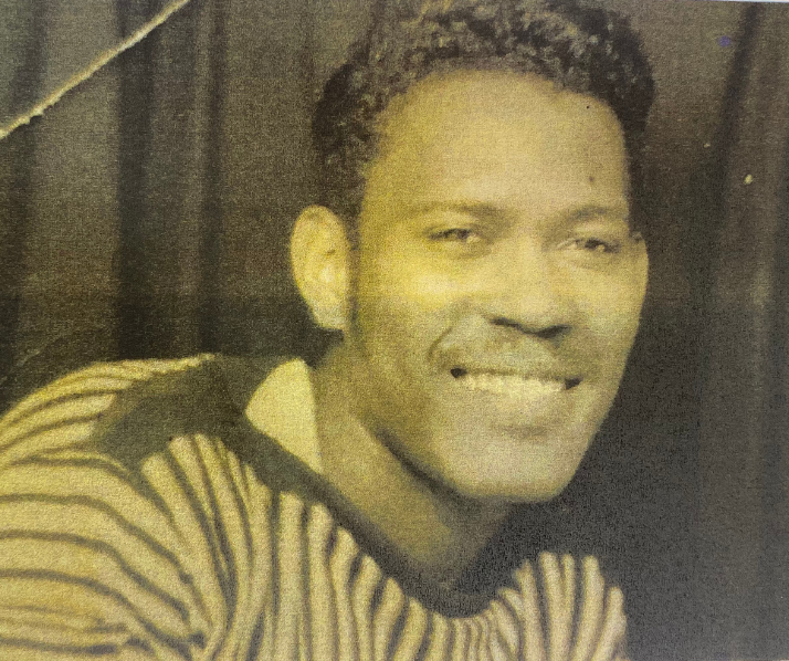 Old photo of man smiling into camera 